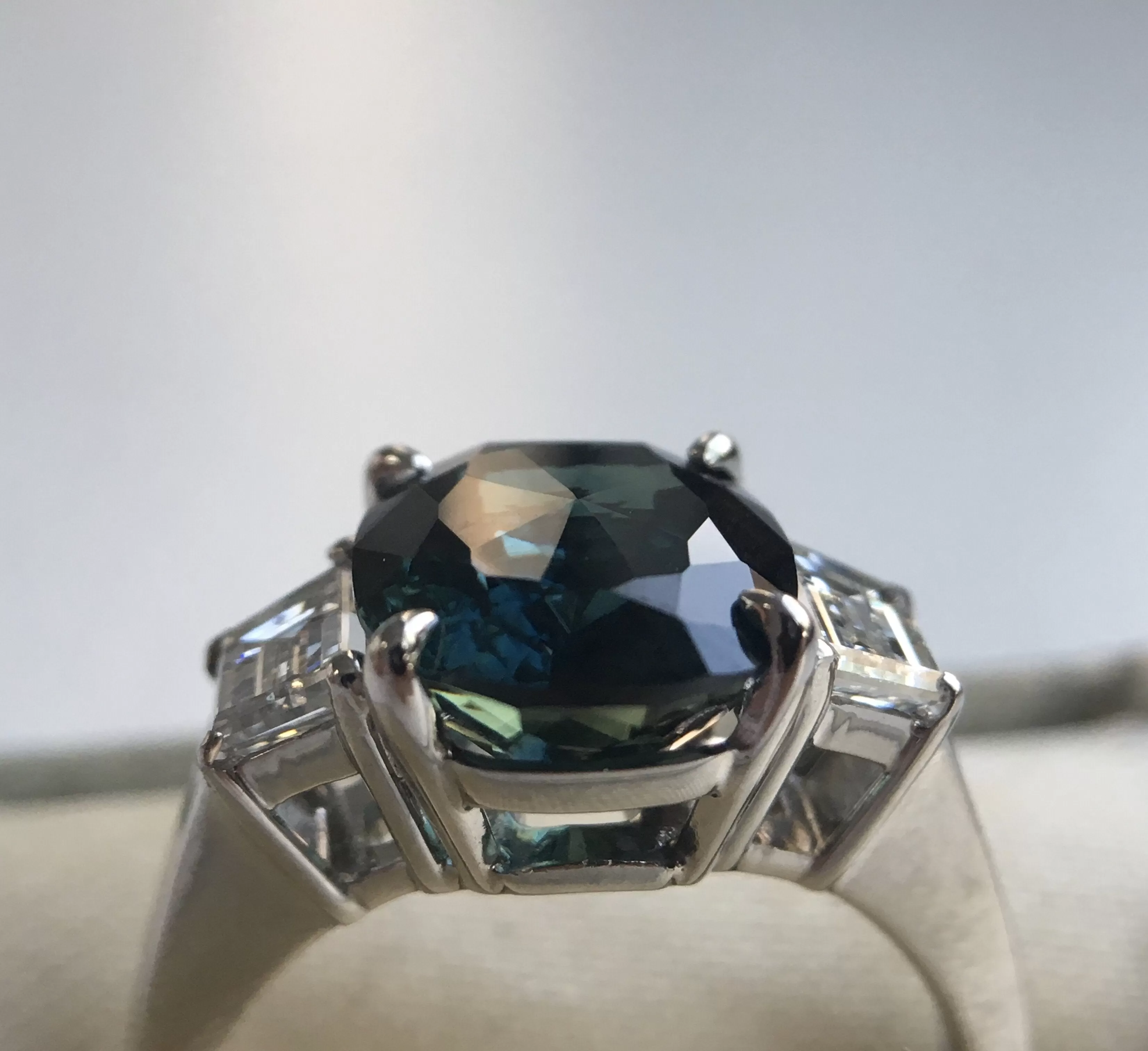 4.41ct Teal Crown Jubilee Cut Cushion Sapphire and Diamond Three Stone Ring