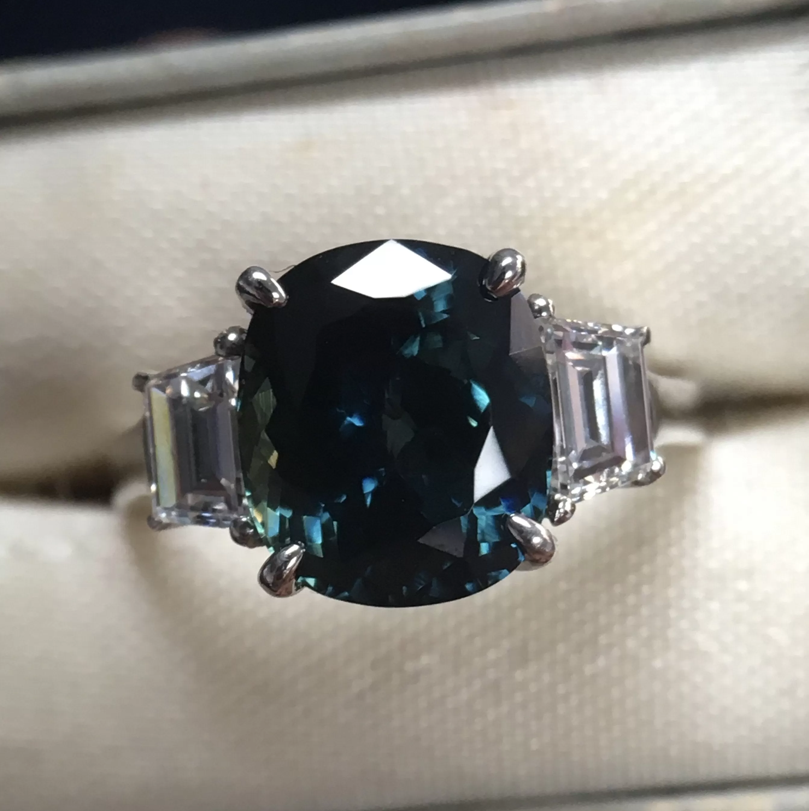 4.41ct Teal Crown Jubilee Cut Cushion Sapphire and Diamond Three Stone Ring